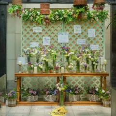 An interactive "Bloom Bar" where guests could create their own small bouquets as a party favor. This is a wonderful way to engage guests and add a personal, floral touch to the celebration.