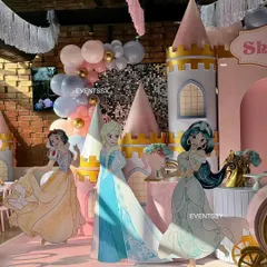 The full lineup of princesses, including Snow White, Elsa, and Jasmine, against the backdrop of a sequin wall and balloon garlands.