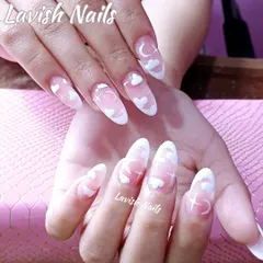 A dreamy, celestial-themed design on long, clear polygel nails. This set features hand-painted white clouds, moons, and stars for a magical, ethereal look.