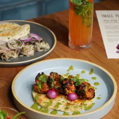 For restaurants, the photo is the first taste. I style and shoot menu items like this vibrant chicken tikka to highlight every detail, from the char on the meat to the fresh garnish, ensuring the dish looks irresistible to customers.