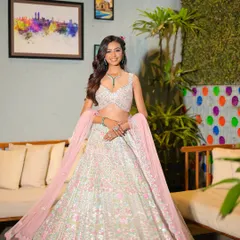 A full-length view of this gorgeous Mehendi outfit. The makeup is designed to be fresh and light, allowing the bride to feel comfortable and beautiful throughout her ceremony.