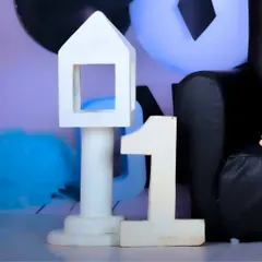 A close-up of "ONE" props used in a Boss Baby themed birthday shoot.