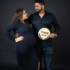A simple and stylish "Coming Soon" announcement. This classic shot against a dark background is a beautiful way for a couple to share their exciting news.