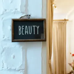 A simple reminder of what we are all about. This little sign marks the entrance to our private treatment rooms, where the real magic of relaxation and transformation happens.