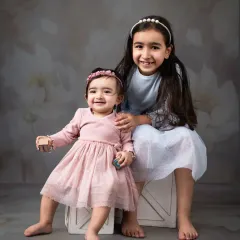 Two sisters, best friends for life. A simple and sweet portrait capturing their close bond.