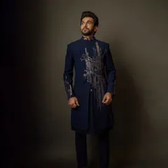 With my tailored precision, Pratik Gandhi proves that style is the ultimate power move. He wears a custom navy blue bandhgala with striking, architectural embroidery.