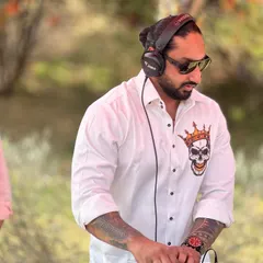 Focused on the mix during a daytime wedding event in Jaipur. My setup includes professional Pioneer DJ equipment to ensure the sound is crisp and the music never stops.
