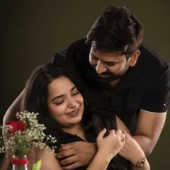 A warm embrace from behind. This photo captures a tender and affectionate moment between a couple, full of love and happiness.