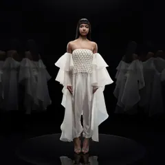 Our studio is equipped for high-end couture photography, where precise lighting control is key. For this Alpana Neeraj campaign, a pure black background and dramatic lighting were used to sculpt the form and highlight the intricate details of the garment.
