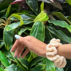 This beige velvet scrunchie is a perfect neutral accessory. The color is subtle and elegant, and the plush texture feels luxurious.