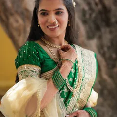 A close-up of the bride, showing the soft makeup and half-up, half-down hairstyle.