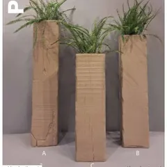 A home without plants is like french fries without sauce. These tall, rustic planters mimic the texture of wooden railway sleepers, adding a raw, natural element to your space.