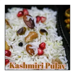 A beautiful and flavorful Kashmiri Pulav, cooked with mild spices and garnished with fried nuts, raisins, and fresh pomegranate seeds. It was the centerpiece of a Thursday happy meal.