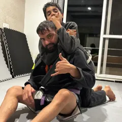 It starts early. Here I am teaching my son the fundamentals of control with a rear-naked choke setup. This is how we build discipline and confidence, right at home.