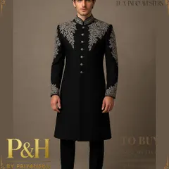 This black Indo-Western suit is the epitome of timeless elegance. I used contrasting silver hand-embroidery on the collar, shoulders, and cuffs to create a striking design that is both classic and powerful.
