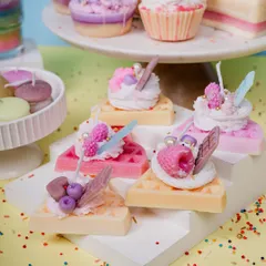 These waffle slice candles are one of my favorite creations. Each one is topped with piped whipped wax and detailed little fruit and chocolate embeds, making them a colorful and fun decorative piece for any kitchen or living space.