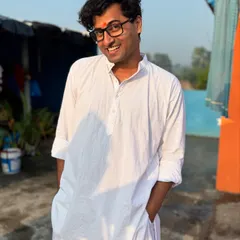 A simple white kurta and a big smile. This is me, relaxed and happy, soaking in the festive vibes.