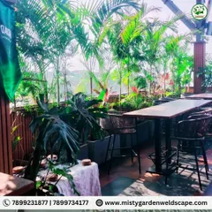 A lush, tropical theme for the outdoor seating area at Skydeck. We used a variety of palms and large-leafed plants to create a dense, green canopy that provides a sense of escape.