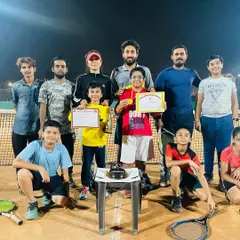 The whole team celebrating together. This group photo captures the fun, family-like atmosphere after a successful junior tournament. It's all about supporting each other.