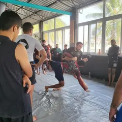 Here, Dustin Stoltzfus demonstrates a takedown technique during his seminar at our institute. Bringing in experts like him provides our students with fresh perspectives and world-class details.