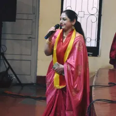 Our guru, Smt. Gayathri Mohan, addresses the audience during the Kannada Rajyotsava event, a celebration of Karnataka's statehood.