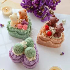 A closer look at some of my heart-shaped cake candles, including designs with cute teddy bears and textured strawberries. These are perfect for baby showers or a bestie's birthday.