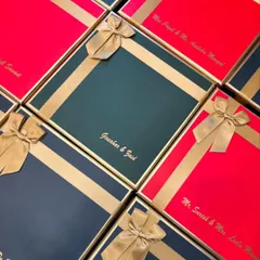 These custom-made signature hampers were created for Gauahar Khan and Zaid Darbar's special day. Each box, in vibrant red and deep green, was personalized with their names for an elegant touch.