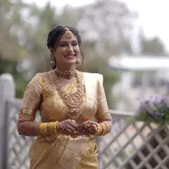 This is one of my beautiful clients, glowing on her special day. The layered antique gold temple jewellery, including a choker and a long haram with a goddess pendant, creates a truly divine look for her muhurtham.