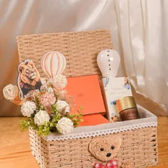 Welcoming a new baby is a precious moment, and I love creating hampers to match. This custom baby announcement basket includes a cute teddy bear, themed decor, and luxury brand gifts, all presented in a beautiful keepsake wicker basket.