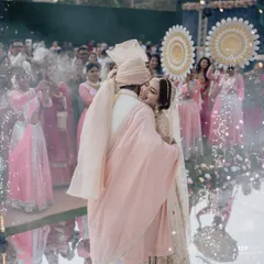 A hug that says everything. We design our Varmala stages, like this one with a mirrored aisle and cold pyros, to create an immersive and emotional atmosphere for the couple and their guests.