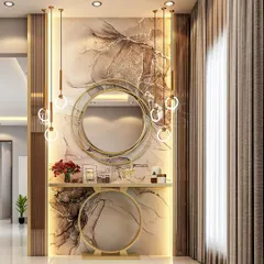 A glamorous foyer featuring a marble accent wall and a striking gold console table with a matching circular mirror. The cascading pendant lights add a final touch of luxury to this stunning entryway.