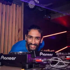 A smile for the camera while spinning a techno set at K-Town Bar. While I'm known for Bollywood, I also love to switch it up and dive into different genres.