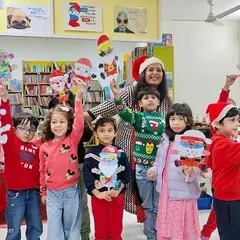 Look at these proud faces! The children are so happy to display their handmade Santa crafts. These activities are not just fun; they also build confidence and a sense of accomplishment.
