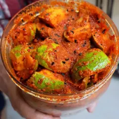 A fresh batch of mango pickle ready for bottling. The vibrant colour comes from fresh ingredients and my special spice mix, with no artificial colours.