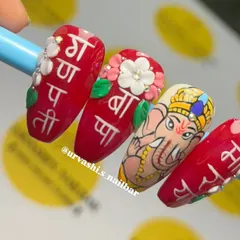 From another angle, you can see how the 3D flowers and lettering add dimension to the design, making the nails stand out. These are the techniques that elevate a manicure into a statement piece.