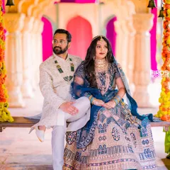 Your pre-wedding shoot should feel as grand as your love story. Here, I used a vibrant, royal backdrop with traditional Indian decor to create a portrait that is both regal and full of personality.