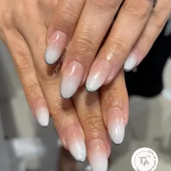 A classic and clean baby boomer or ombré French manicure, blending a soft nude base into a crisp white tip for a timeless look.