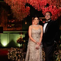 The happy couple at their stunning reception. My goal is always to create a backdrop that not only wows guests but also feels like a true reflection of the couple's style and personality.