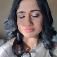 A beautiful, natural makeup look for a client attending her daughter's baptism. The focus is on soft, neutral tones for the eyes and a peachy-pink lip.