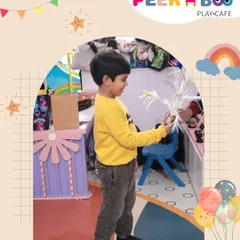The birthday boy, Ahaan, participating in the magic show at his party.