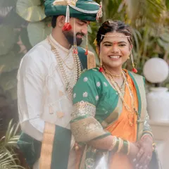 A beautiful moment between our Maharashtrian bride and groom. Her makeup is designed to look fresh and radiant throughout the day's celebrations.