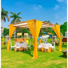 A beautiful canopy seating area for a construction-themed party. The bright yellow drapes add a pop of colour to the lawn and provide a comfortable, shaded spot for guests to relax.