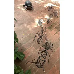 A line of ants and a dung beetle, sculpted from recycled steel, march across our studio floor. These playful art pieces are a constant reminder of our connection to the natural world and our belief in sustainable creativity.