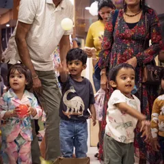 The pure joy of a child at play during a Dino Carnival event I organized. I capture these unscripted moments of fun that families will cherish for years to come.