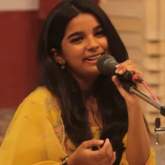 The joy of singing is evident on this young student's face during her performance at the 'Swarveni Aradhana'. We nurture talent from a very young age.