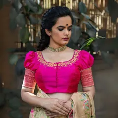 A closer look at the craftsmanship of my custom-fit blouses. This piece features intricate hand-embroidery around the neckline and puffed sleeves with a traditional woven border, designed to provide a perfect fit for curvy women.