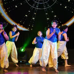 Our junior Bollywood troupe performing at Zest 25. Dressed in sparkling blue and gold costumes, they brought the fun and flair of filmy dance to life.