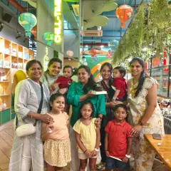 A multi-generational family celebrates a birthday together in our cafe. We provide a comfortable space for everyone to gather, eat, and enjoy the cake-cutting ceremony.