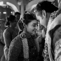 An intimate, black and white moment between the bride and groom during the mangalyam ceremony. I focus on these fleeting glances and gentle touches that hold so much emotion.