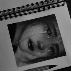 This hyper-realistic sketch of a girl's sorrowful expression is one of my most emotional pieces. I used fine pencils and blending stumps to create the realistic tears and the depth in her eyes.